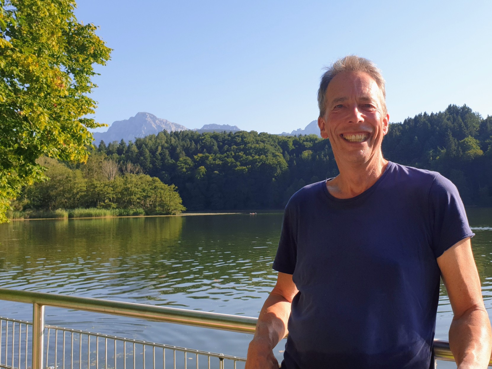 ian with a lake in the baground